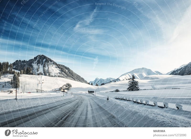 Winter landscape in the Alps Berge u. Gebirge Natur Landschaft Alpen Verkehr Verkehrsmittel Verkehrswege Autofahren Straße kalt blau weiß mountains hill Berwang