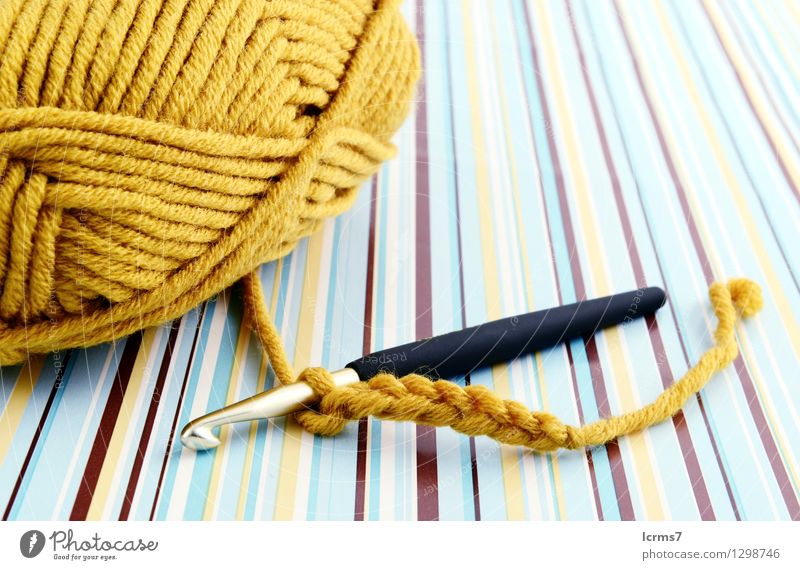 crocheting with brown wool. retro paper background. Design Freizeit & Hobby Handarbeit stricken gebrauchen Captain Hook yarn craft handmade pattern