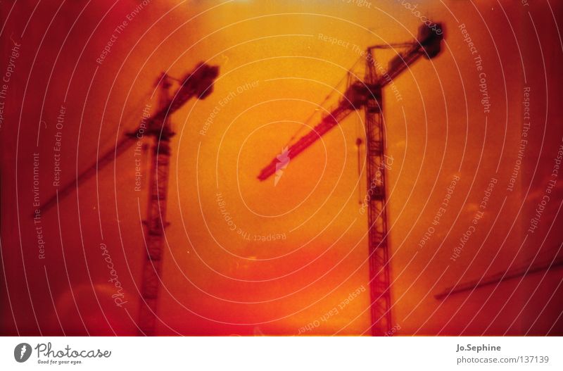 construction time, again - himmel brennt Baustelle Industrie Himmel Surrealismus Kran analog Diana+ 35mm 2 rot orange Experiment Lomografie lomography