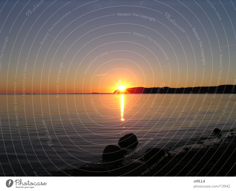 Rügener Sonnenuntergang II Sonnenstrahlen Meer Beleuchtung Abend Wasser Küste Stein Reflexion & Spiegelung