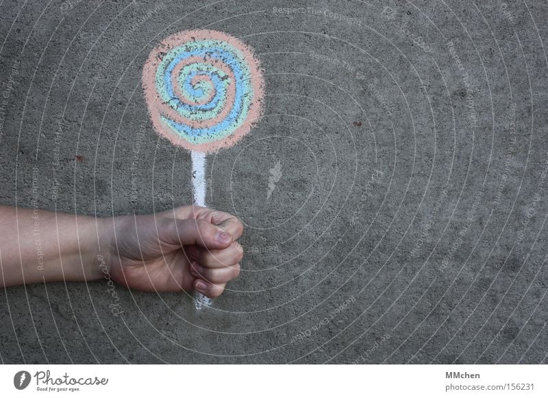 kalorienarm Lollipop Süßwaren süß lutschen Ernährung Kreide Gemälde zeichnen Beton Betonwand Hand Kindergeburtstag Graffiti Wandmalereien Malerei u. Zeichnungen