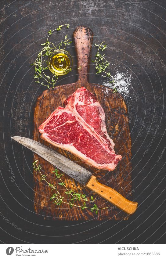 T-Bone- Steak auf alter Schneidebrett mit Messer Lebensmittel Fleisch Kräuter & Gewürze Öl Ernährung Mittagessen Abendessen Picknick Bioprodukte Stil