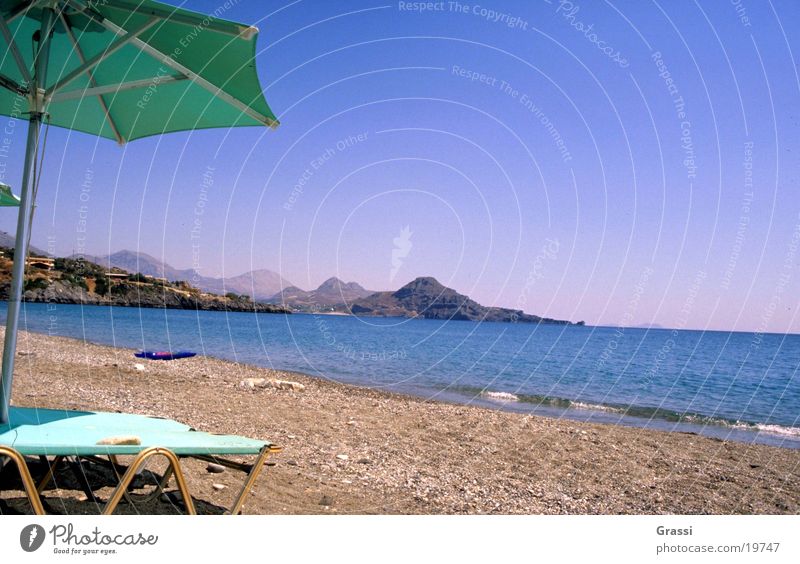 Beach Griechenland Kreta Strand Meer entfalten Ferien & Urlaub & Reisen lesen Liege Sonne Sonnenschirm heiß Brandung Luft salzig Wärme bequem Europa