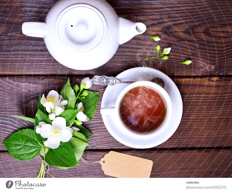 Tasse schwarzer Tee Frühstück Becher Tisch Blume Blatt Papier Blumenstrauß Holz frisch heiß braun grün weiß Tradition Jasmin trinken Lebensmittel Tag Top