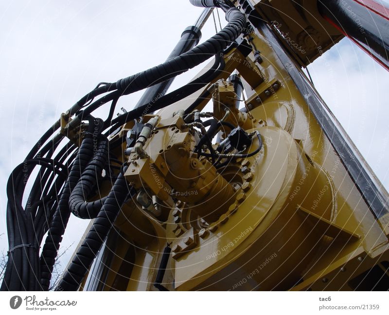 Hydraulikschläuche Maschine Stahl Schraube gelb Baumaschine Elektrisches Gerät Technik & Technologie hydraulisch Nahaufnahme Kabel Baustelle