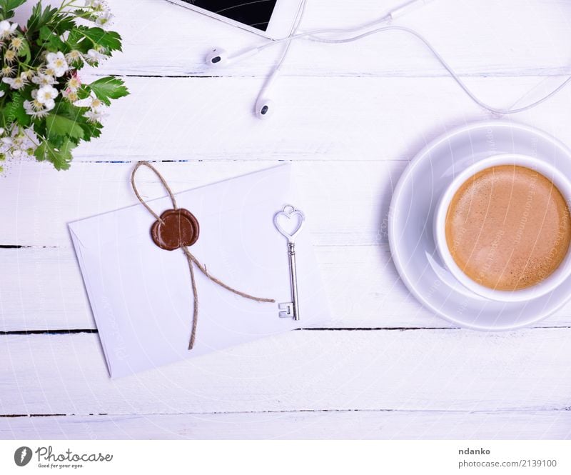 Tasse Kaffee Frühstück Kaffeetrinken Heißgetränk Becher Telefon PDA Blume Blühend Essen oben Kuvert Siegel Taste Blütenknospen Top Kopfhörer Farbfoto