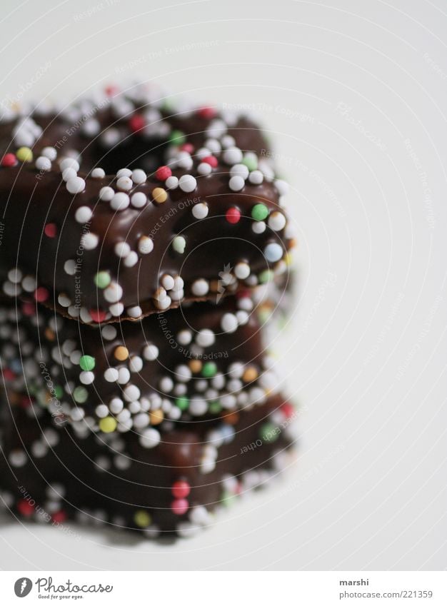 Pünktchen auf Schokolade Süßwaren Ernährung lecker braun mehrfarbig Punkt Stapel Unschärfe ungesund Appetit & Hunger Farbfoto Innenaufnahme Streusel