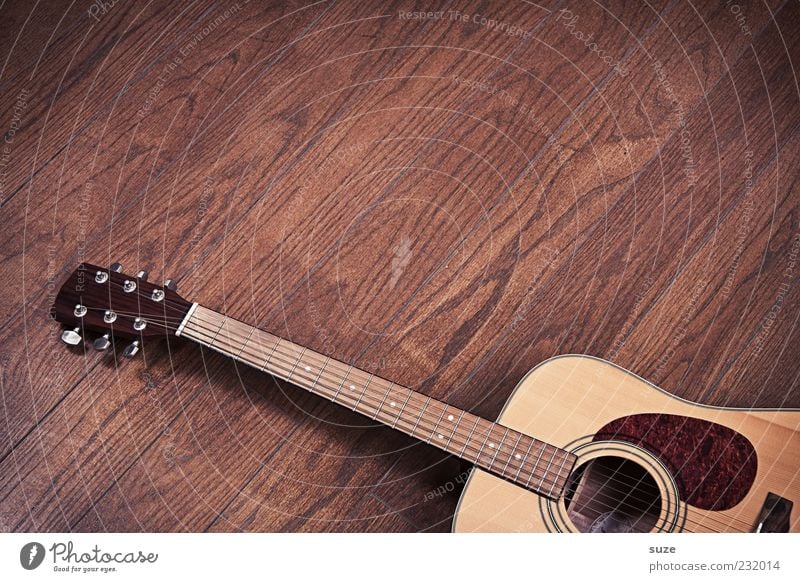 Bodenschatz Musik Gitarre Holz authentisch einfach natürlich braun Musikinstrument Saite Klang Griffbrett Holzfußboden Maserung liegen Parkett Laminat kultig
