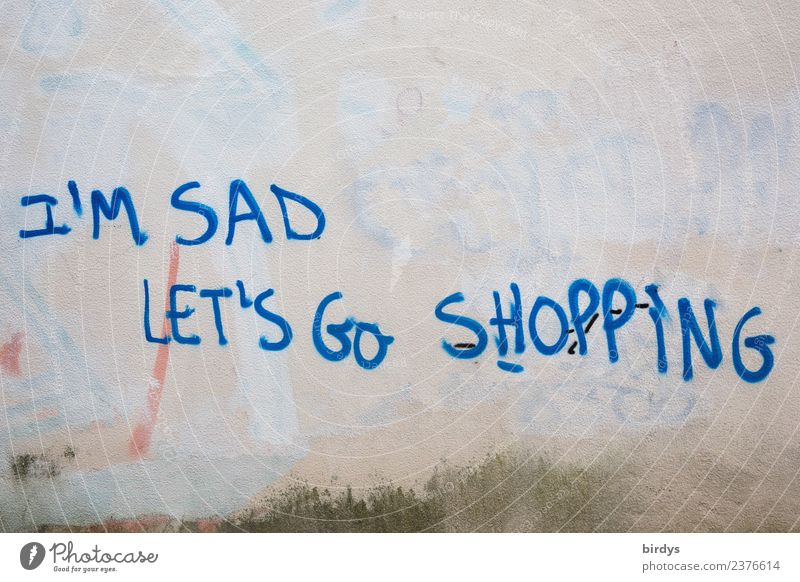 Konsumieren als Ersatzbefriedigung bei Depression und Traurigkeit. Grafitti Schrift auf englisch konsumieren shopping Lifestyle kaufen depression Reichtum Gemüt