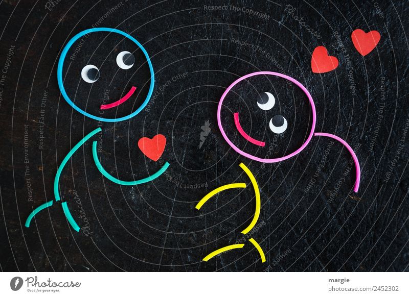 Gummiwürmer: Liebeserklärung maskulin feminin Mädchen Junge Auge 2 Mensch mehrfarbig rot schwarz Gefühle Vorfreude Vertrauen Einigkeit Freundschaft Zusammensein