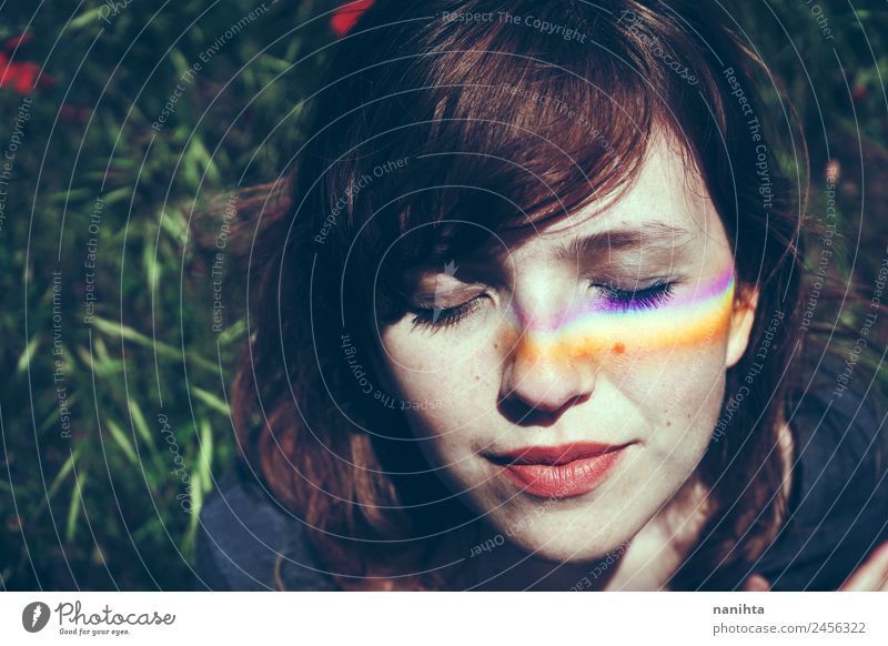 Junge Frau mit einem Regenbogen im Gesicht Lifestyle Stil Design schön Wellness harmonisch Wohlgefühl Sinnesorgane Erholung Meditation Mensch feminin