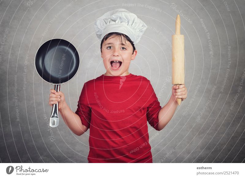 Glücklicher kleiner Junge in Kochuniform Ernährung Abendessen Diät Lifestyle Freude Küche Restaurant Kind Gastronomie Business Mensch maskulin Kindheit 1