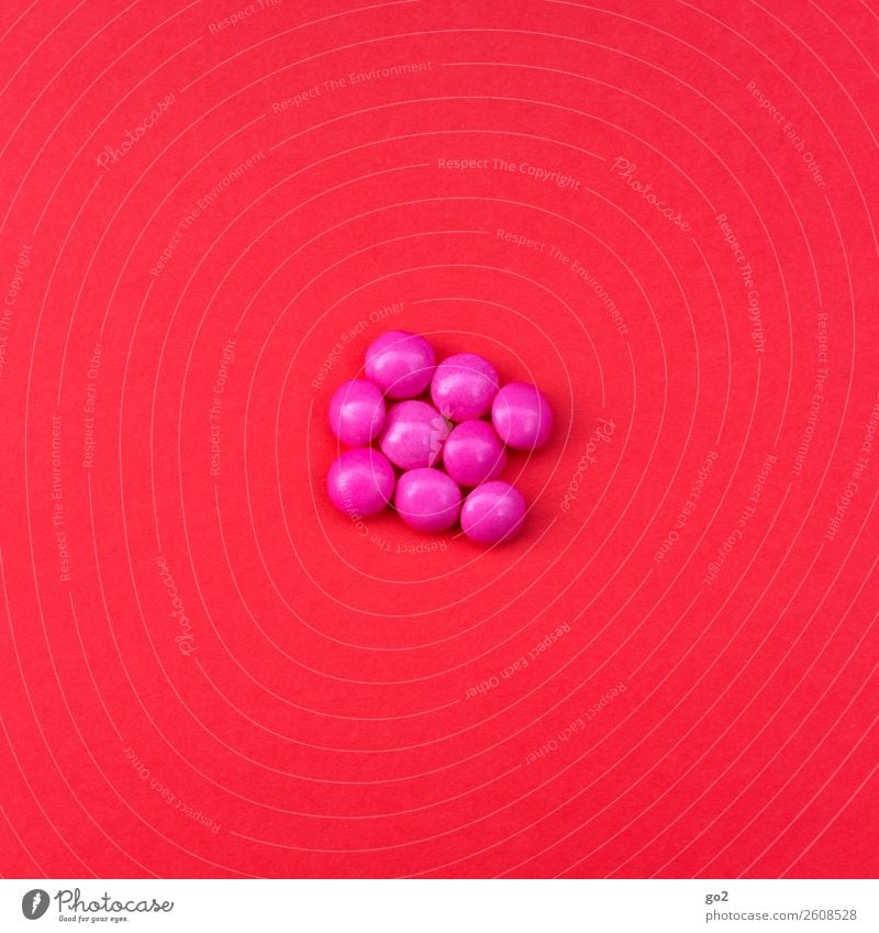 Pinke Pillen auf Rot Lebensmittel Süßwaren Ernährung Gesundheit Gesundheitswesen Behandlung Medikament ästhetisch rund rosa rot Erschöpfung Drogensucht