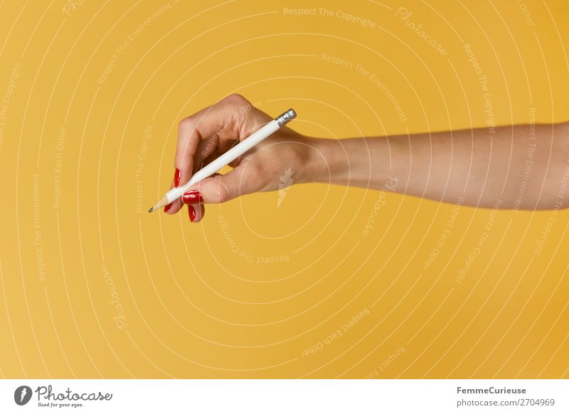 Forearm and hand with pencil against a yellow background feminin 1 Mensch Kommunizieren Hand Finger Nagellack rot gelb zeichnen schreiben Bleistift Unterarm