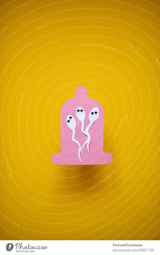 Contraception - sperm with wobbly eyes in condom Zeichen Sex Sexualität rosa gelb Papier ausgeschnitten Symbole & Metaphern Kondom Spermien 3 Wackelaugen Auge