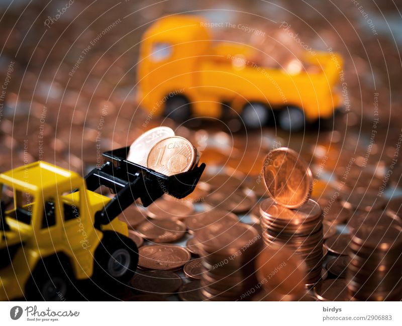 Entsorgung von 1 Cent - und 2 Centmünzen Geld Arbeitsplatz Baustelle Kapitalwirtschaft Lastwagen Radlader Zeichen Eurozeichen Geldmünzen Bewegung gelb orange