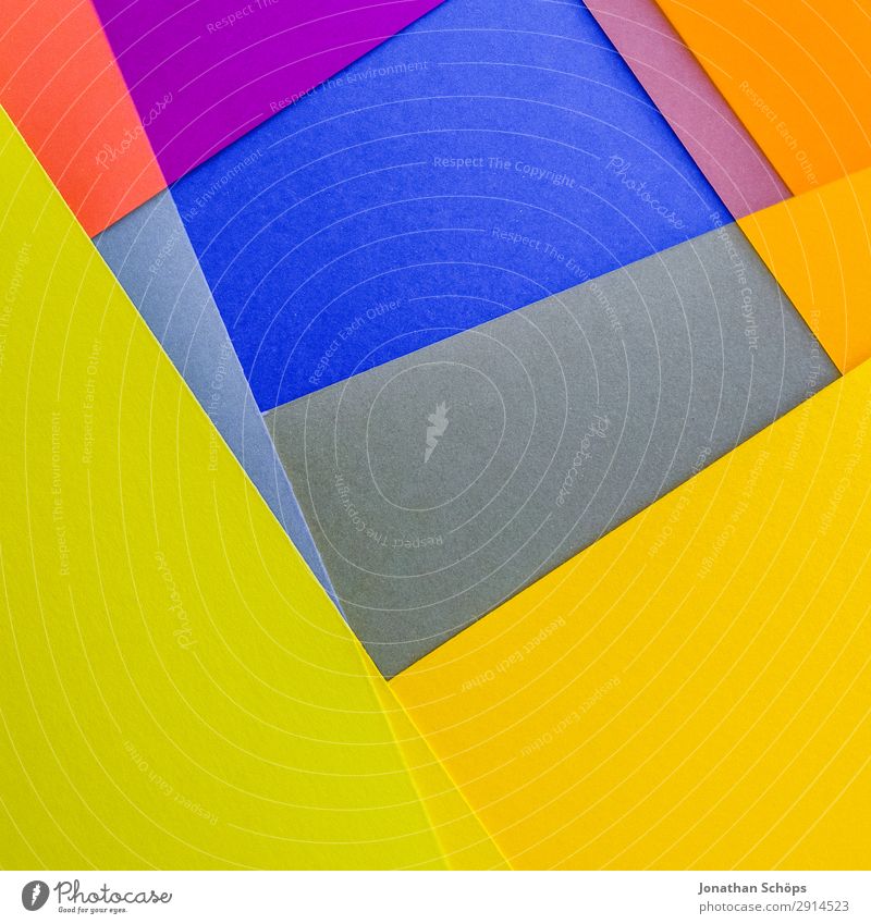 grafisches Hintergrundbild aus Buntpapier Basteln Papier leuchten einfach blau gelb rosa rot Quadrat flach Geometrie graphisch grell Entwurf minimalistisch