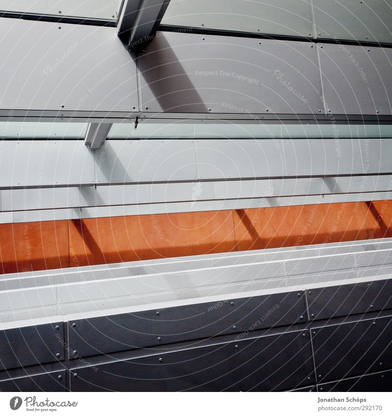Stahl Bauwerk Gebäude Architektur ästhetisch Fenster Schatten Lichteinfall grau schwarz orange Linie Muster Geometrie aufstrebend positiv Strukturen & Formen