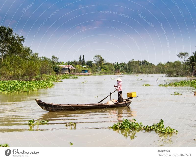 Boot, das durch das Mekong-Delta segelt. schön Ferien & Urlaub & Reisen Haus Natur Fluss Dorf Wasserfahrzeug grün Asien asiatisch farbenfroh Osten fliegend