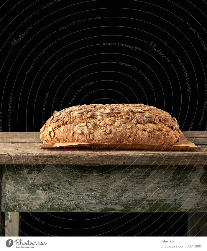 Brot aus Roggenmehl mit Kürbiskernen Ernährung Frühstück Diät Tisch Holz frisch oben braun grau Tradition backen Bäckerei Lebensmittel Feinschmecker Korn
