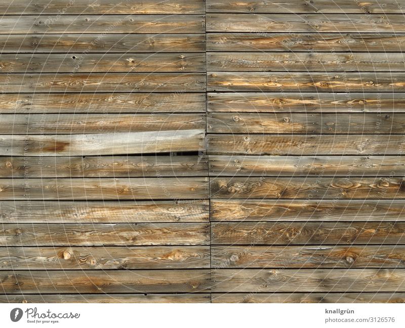 Geheimfach Mauer Wand Fassade Holz Kommunizieren alt kaputt braun geheimnisvoll Preisschild Verfall Holzbrett Holzwand Farbfoto Außenaufnahme Menschenleer