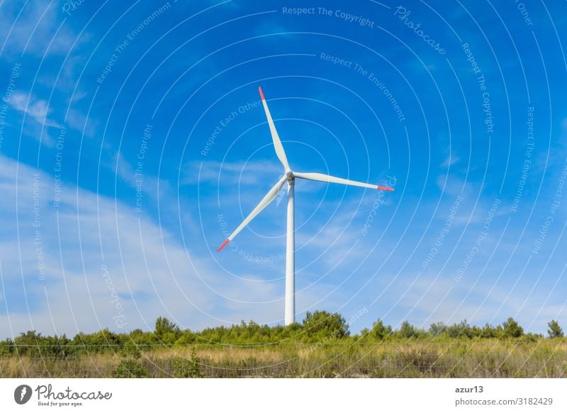 Rotating windmill generating renewable energy wind power at land Wirtschaft Energiewirtschaft Business Erfolg Technik & Technologie Wissenschaften Fortschritt