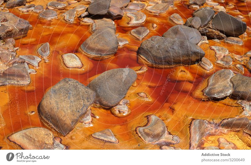 Leuchtend orangefarbene Spritzer in der Natur Überleitung Hintergrundbild Berge u. Gebirge abstrakt Felsen geologisch Orange strömen Stein gelb schön natürlich