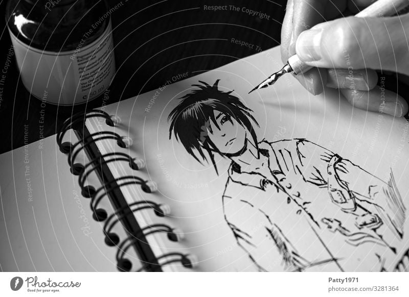 Detailaufnahme einer Hand, die mit einer Zeichenfeder eine Mangafigur in ein Skizzenbuch zeichnet 1 Mensch Kunst Künstler Maler Zeichnung Comicfigur Tusche