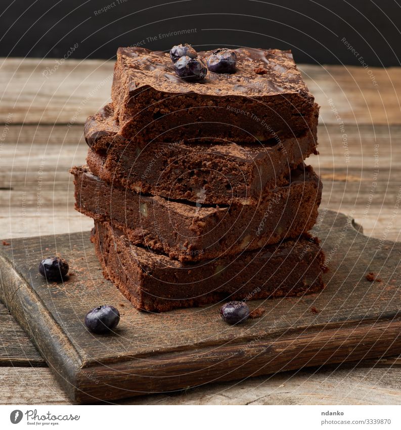 gebackene Scheiben Brownie-Schokoladenkuchen Kuchen Dessert Ernährung Essen Kakao Tisch Holz dunkel frisch lecker braun schwarz Tradition Bäckerei Biskuit