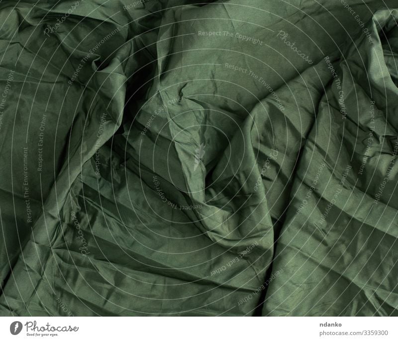 grüner Satin-Textilstoff Reichtum elegant Design Mode Stoff glänzend dunkel weich Farbe Material Hintergrund Leinwand Sahne zerknittert Gardine Kurve filigran