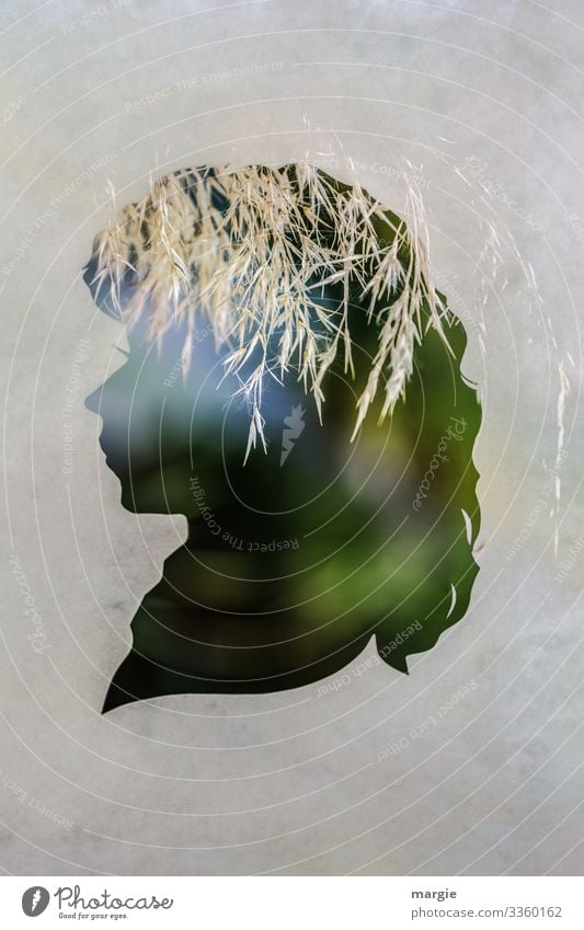 Profil einer Frau als Scherenschnitt mit Gräsern als Kopfschmuck Gras Doppelbelichtung Heu Licht Silhouette kreativ grün Natur Papier papierschnitt Gesicht