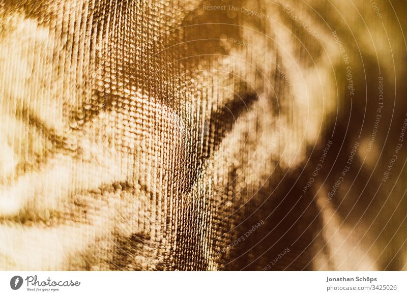 Textur der glänzenden Goldhintergrundfolie Hintergrund hell abschließen Folie glamourös eklatant gold golden Material perlmuttartig Fotografische Ausrüstung