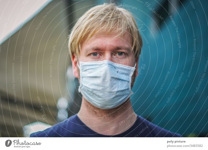 Coronavirus: Covid-19-Gefahr. Porträt eines jungen Mannes mit einer Mund-Nasen-Maske, biologische Gefahr Person Epidemie Schutz Virus Grippe Umweltverschmutzung