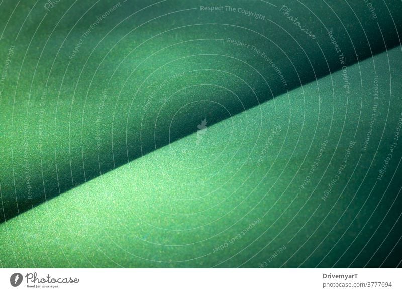 Grün metallisch glänzende Oberfläche mit einer diagonalen Linie Hintergrund grün Textur Blatt Metall Glitter graphisch Punkte Farbe Betrachtungen Kunst abstrakt