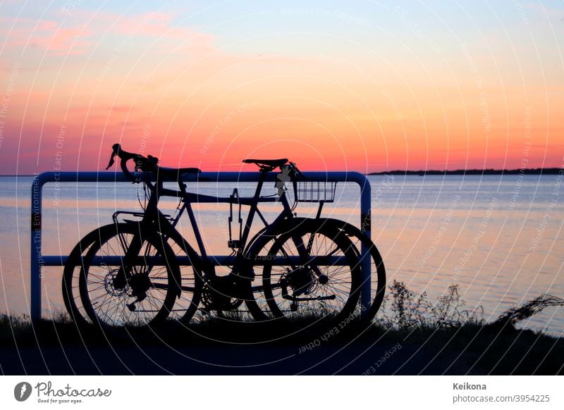Parked bicycles on sea shore. Sunset environment. active adventure background baltic baltic sea bicycling bike biking coast competition deutschland europe