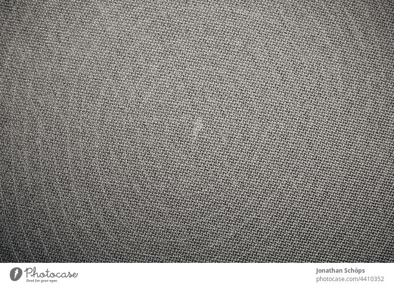 graue Textiloberfläche Textur Stoff Hintergrund Material Gewebe Design Muster abstrakt Mode Detailaufnahme texturiert Bekleidung Oberfläche vignette Sitzkissen