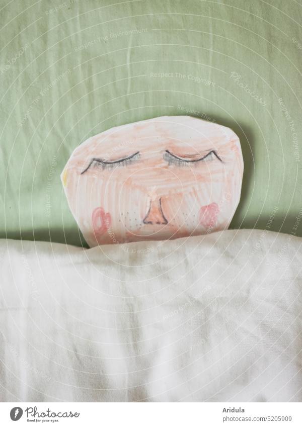 Heute im Bett bleiben | gezeichnetes Gesicht liegt bis zur Nase zugedeckt im Bett Zeichnung Kind Schlaf schlafen Augen ausruhen rosa mint Kopfkissen Bettdecke