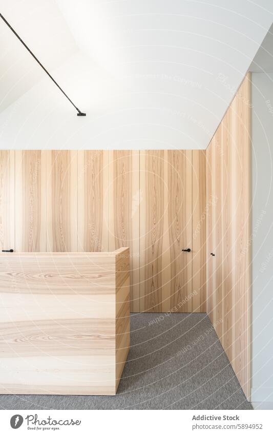 Modernes Interieur einer Zahnklinik mit minimalistischer Holzverkleidung Klinik dental Innenbereich modern Verkleidung Rezeption Schreibtisch Wand Zimmerdecke