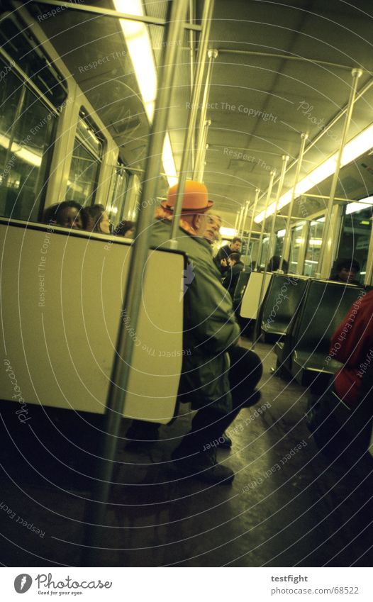 sitting in a subway to central amsterdam Mensch U-Bahn fahren sitzen Mobilität London Underground unterwegs Beleuchtung Licht Öffentlicher Personennahverkehr