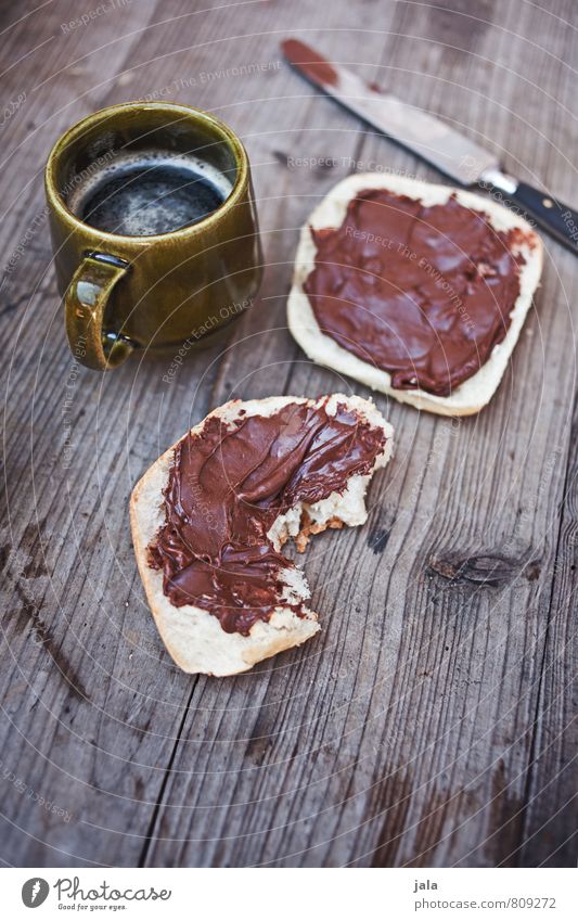 nuss-nougat Lebensmittel Brötchen Nussnugatcreme Ernährung Frühstück Getränk Heißgetränk Kaffee Tasse Becher Messer frisch lecker Appetit & Hunger Holztisch